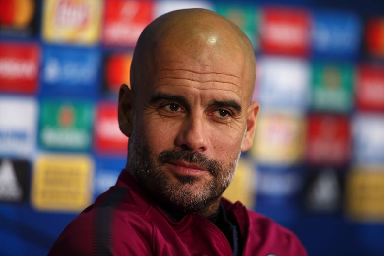 Pep Guardiola smiling