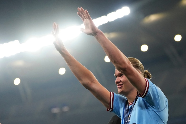 Haaland with his arms in the air